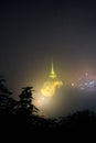 Night view of kyaiktiyo pagoda or Golden Rock with fog background are pagoda is famous tourist attraction in Mon state, Myanmar Royalty Free Stock Photo