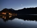 Night view of the lake Schliersee and crescent moon over the Bavarian Alps, Bavaria, Germany, November 2022 Royalty Free Stock Photo