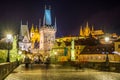 Night view of the Lesser Town Bridge Tower, form the entrance to the Lesser Town from Charles Bridge, and Prague Castle, the Royalty Free Stock Photo