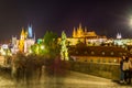 NIght view of the Lesser Town Bridge Tower, form the entrance to the Lesser Town from Charles Bridge, and Prague Castle, the Royalty Free Stock Photo