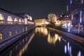 Night view of Ljubljanica River with famous Triple Bridge and medieval colorful buildings in Ljubljana