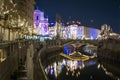 Night view of Ljubljanica River with famous Triple Bridge and medieval colorful buildings in Ljubljana