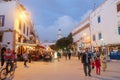 Night view of locals and tourists walking in the ancient old town. Essaouira, Morocco.