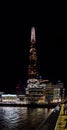 Night view of London skyscraper The Shard, office buildings, London Bridge hospital and tourists taking photos from the bridge to Royalty Free Stock Photo