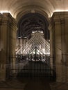 Night view of Louvre pyramid from inside the museum, Paris, France