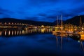 Night view of marina area in Tromso with Tromso Bridge in the distance Royalty Free Stock Photo