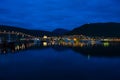 Night view of marina area in Tromso with Tromso Bridge in the distance Royalty Free Stock Photo