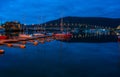 Night view of marina area in Tromso with Tromso Bridge in the distance Royalty Free Stock Photo