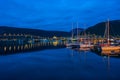 Night view of marina area in Tromso with Tromso Bridge in the distance Royalty Free Stock Photo