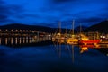 Night view of marina area in Tromso with Tromso Bridge in the distance Royalty Free Stock Photo