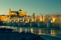 Night view of Mezquita-Catedral and Puente Romano - Mosque-Cathedral and the Roman Bridge in Cordoba, Andalusia, Spain Royalty Free Stock Photo