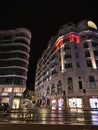 Night view of modern buildings in the downtown of Cannes, French Riviera, France in evening with illuminated shop windows.