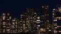 Night view of modern luxury residential high-rise buildings at False Creek in Vancouver downtown, Canada with illuminated windows. Royalty Free Stock Photo