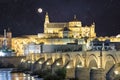 Night view of Mosque-Cathedral and the Roman Bridge in Cordoba, Andalusia, Spain Royalty Free Stock Photo