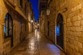 Night view of a narrow street in the historical center of Dubrovnik, Croatia Royalty Free Stock Photo