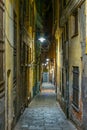 night view of a narrow street in the historical center of the italian city genoa....IMAGE Royalty Free Stock Photo