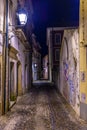 Night view of a narrow street at the old town of Coimbra, Portugal Royalty Free Stock Photo