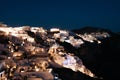 Night view of Oia town in Santorini island, Greece. Summer vacation and holiday concept, luxury travel. Royalty Free Stock Photo