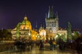 Night view of  Old Town Bridge Tower and background of  Church of St Francis Seraph at the bank of River Vltava, view from the Royalty Free Stock Photo