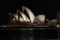 a night view of the opera house from across the water