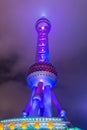 Night view of the The Oriental Pearl Tower at a cloudy day after raining with colorful  light in Pudong, Shanghai, China Royalty Free Stock Photo