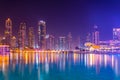 Night view over the burj khalifa lake with building of the dubai opera Royalty Free Stock Photo