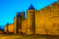 Night view over illuminated fortification of Carcassonne, France