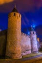 Night view over illuminated fortification of Carcassonne, France