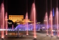 Illuminated main fountain and people`s house Parliament House in Bucharest, Romania, 07.23.2020 Royalty Free Stock Photo