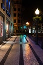 Night view over street of Funchal with its famous black an white ancient pavement