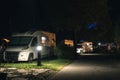 Night view of the parking lot for a motorhome, camper van, campsite camp for sleeping and relaxing. vacation and travel tour Royalty Free Stock Photo