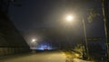 The night view of the pass road is full of fog with magical street lights