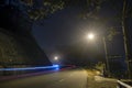 The night view of the pass road is full of fog with magical street lights