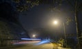 The night view of the pass road is full of fog with magical street lights