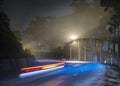 The night view of the pass road is full of fog with magical street lights