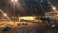 Night view of passenger plane standing in airport on the concrete paved terminal Royalty Free Stock Photo