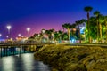 Night view of people are strolling on Molos promenade on Limassol, Cyprus