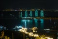 Night view of the Phoenix island in the Sanya city with bright multi-colored illumination buildings, structures and ships. Sanya Royalty Free Stock Photo