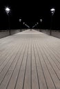 Night view of a pier and lamp posts Royalty Free Stock Photo