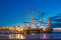 A night view of the Pier and wheel of Scheveningen during sunset Royalty Free Stock Photo