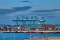 Night view of the port of Algeciras, full of containers and huge cranes