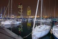 Night view of Port Olimpic harbor and marina in Olympic village in Barcelona. Mooring yachts, boats and other Royalty Free Stock Photo