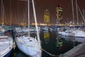 Night view of Port Olimpic harbor and marina in Olympic villageVila Olimpica in Barcelona. Mooring yachts, boats and other Royalty Free Stock Photo