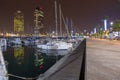 Night view of Port Olimpic harbor and marina in Olympic village in Barcelona. Mooring yachts, boats and other Royalty Free Stock Photo