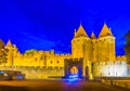 Night view of Porte Narbonnaise leading to the old town of Carcassonne, France