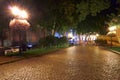 Night view of Primorsky boulevard in Odessa city, Ukraine. Beautiful city Park and street illumination, walking people