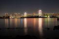 Night view of Rainbow Bridge with reflection in Tokyo Bay Royalty Free Stock Photo