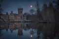 Night view of the ruins of the palace in Kopicach during the full moon