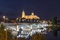 Night view of Salamanca Old and New Cathedrals from Enrique Esteban Bridge over Tormes River, Community of Castile and LeÃÂ³n, Royalty Free Stock Photo