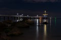 Night view of the sea pier, beautiful colorful light reflections in the water - Burgas, Bulgaria Royalty Free Stock Photo